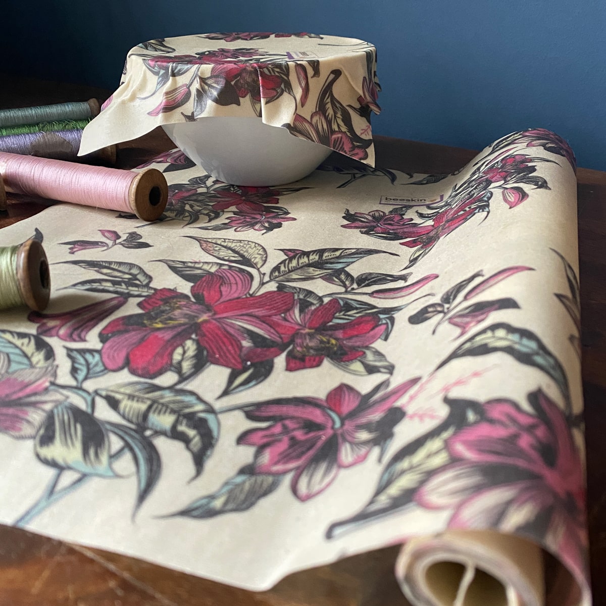 showing victorian flower design on a roll and a white bowl covered with a beeswax wrap