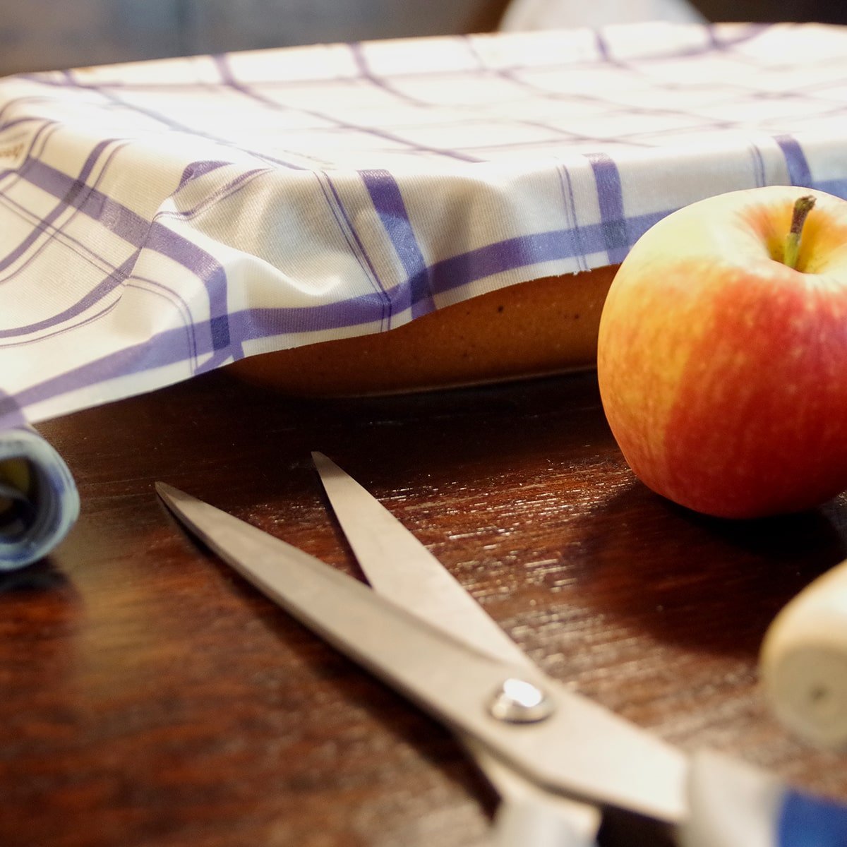 beeskin beeswax roll kitchen on a casserole and scissors to cut the wrap