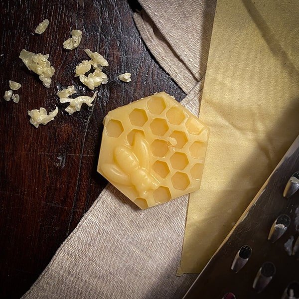 crumbs of beeskin beeswax repair mixture in the form of a honeycomb