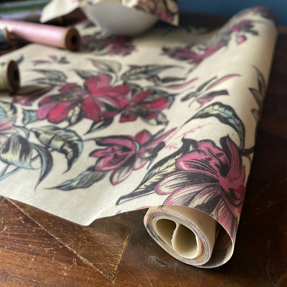 beeskin beeswax roll pink victorian design rolled up on a wooden taeble