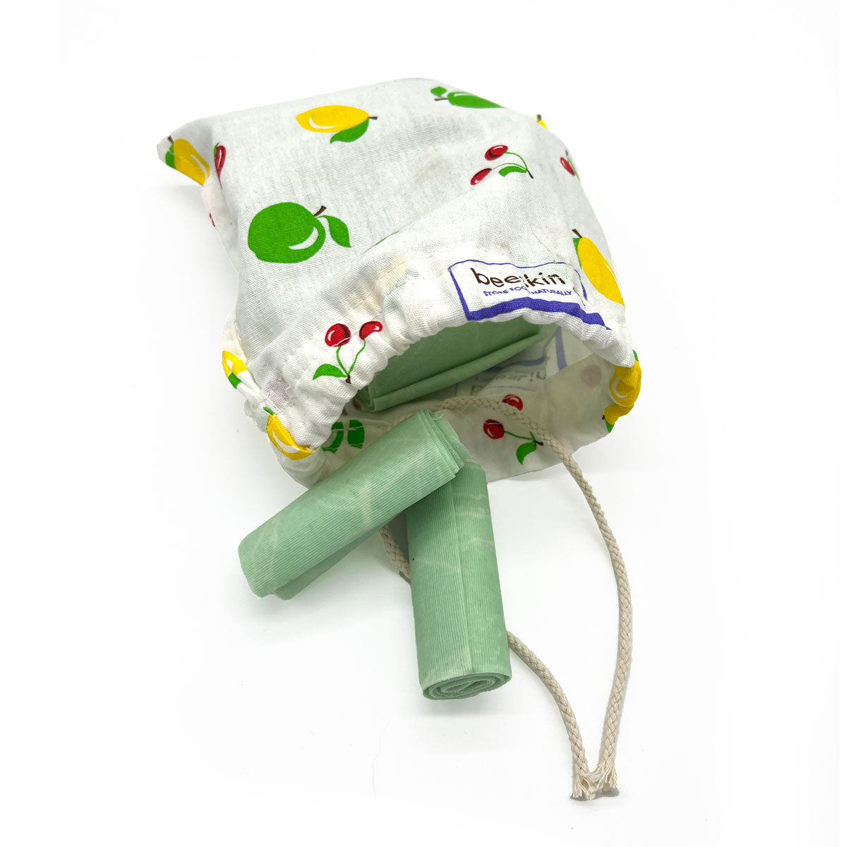 little firestarter in a fabric bag with fruit print