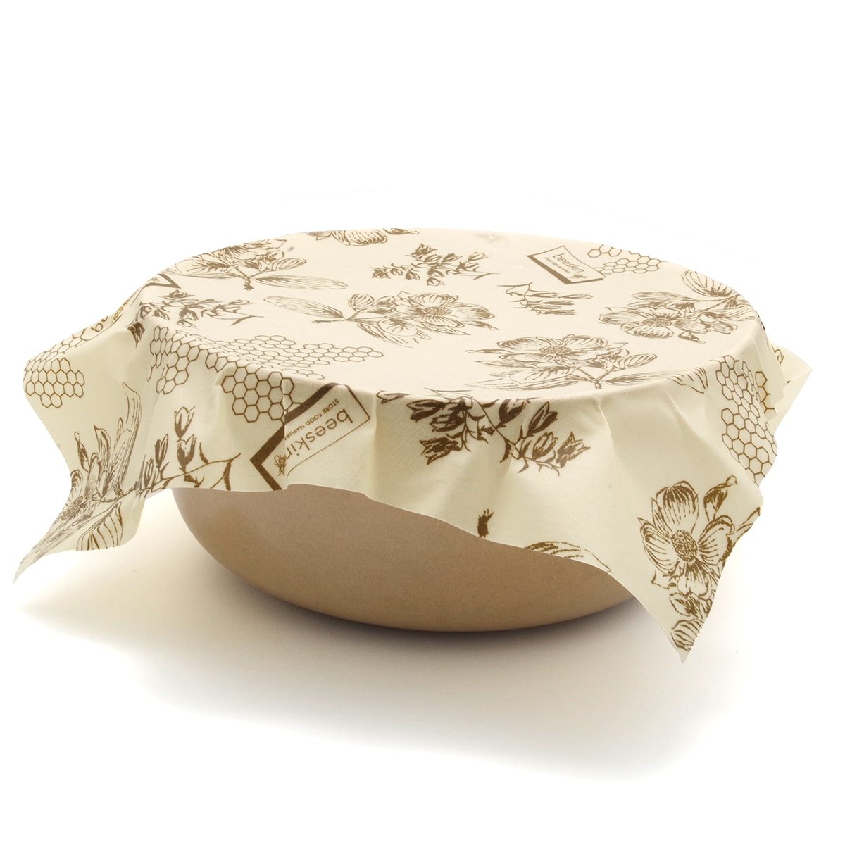 beeskin beeswax wrap size L in flower design. wrapping a bowl.