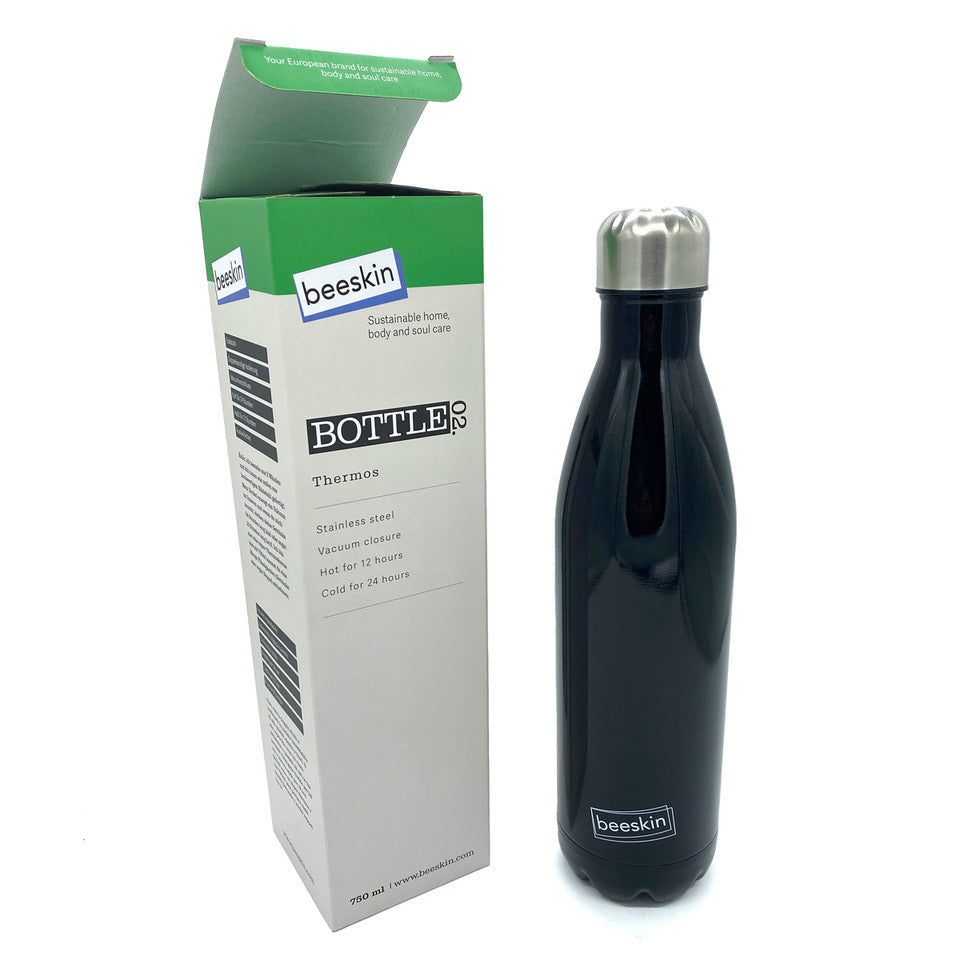 black thermobottle with beeskin logo next to packaging