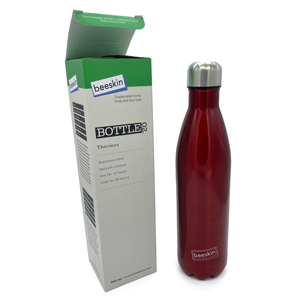 red thermobottle with beeskin logo next to packaging