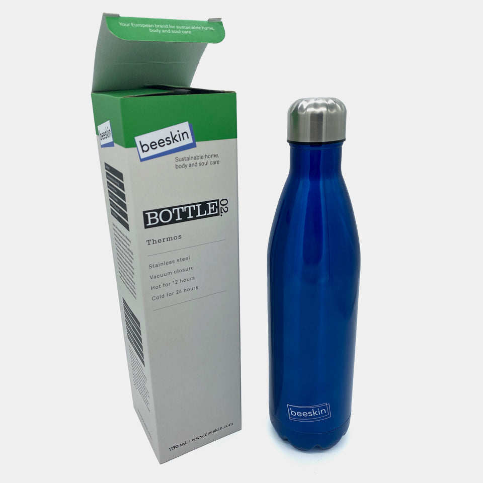 blue thermobottle with beeskin logo next to packaging