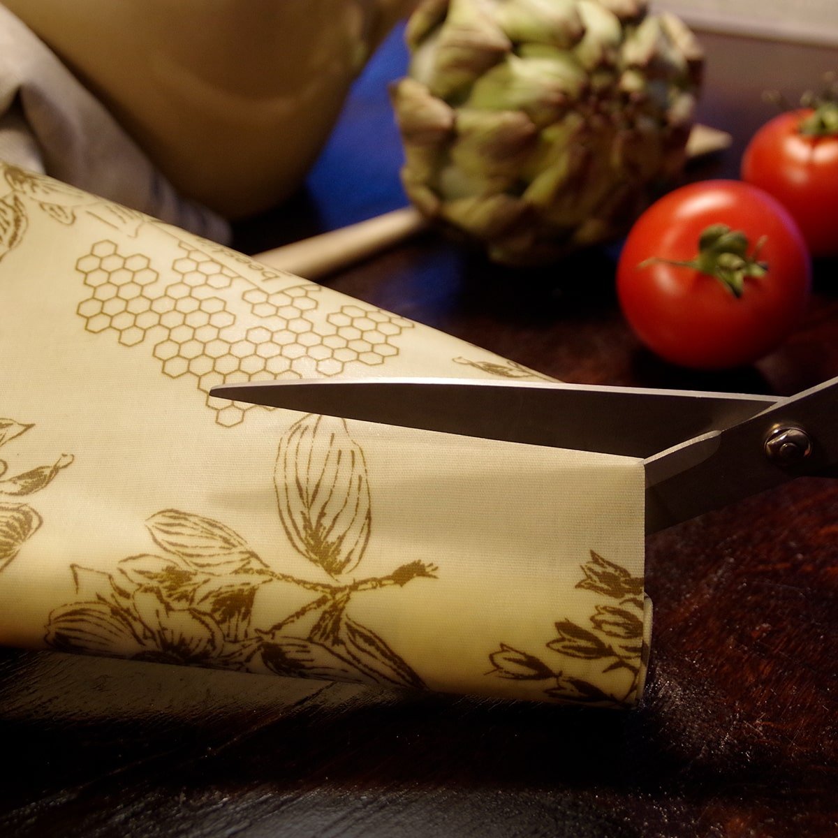 scissors that cut beeskin beeswax roll flower into pieces
