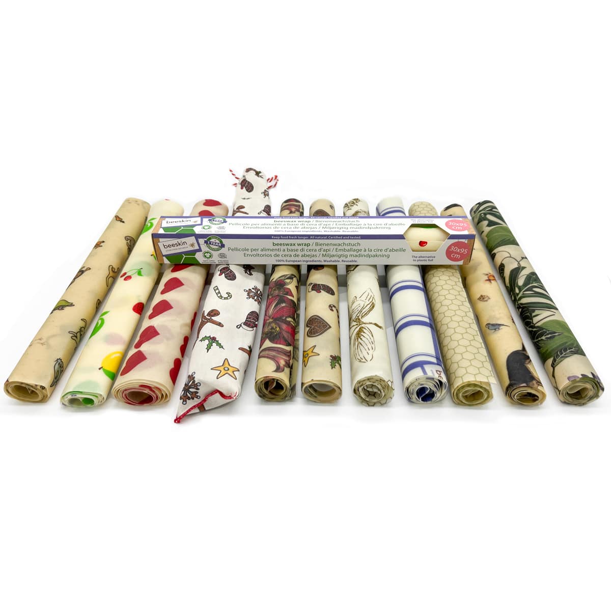 showing 11 different beeswax wrap rolls next to one another on white background.