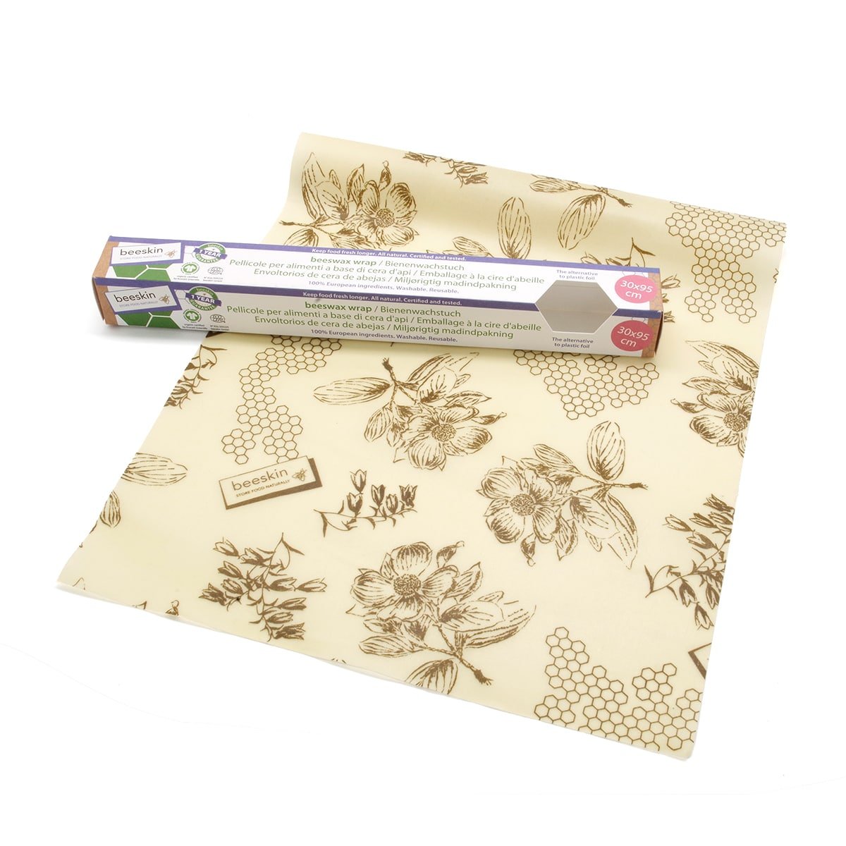 beeskin beeswax roll flower design next to packaging