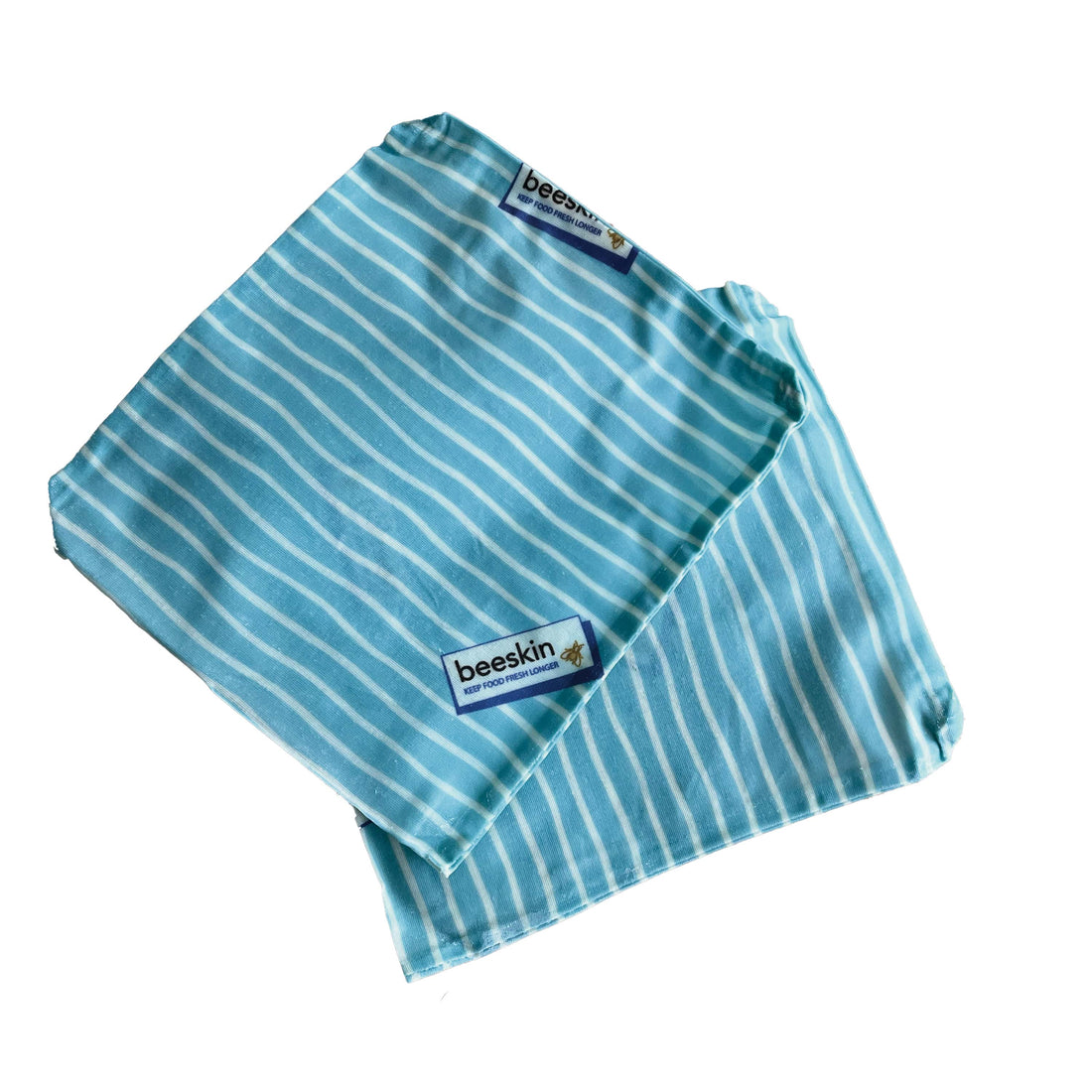 two blue beeswax bag s with white stripes