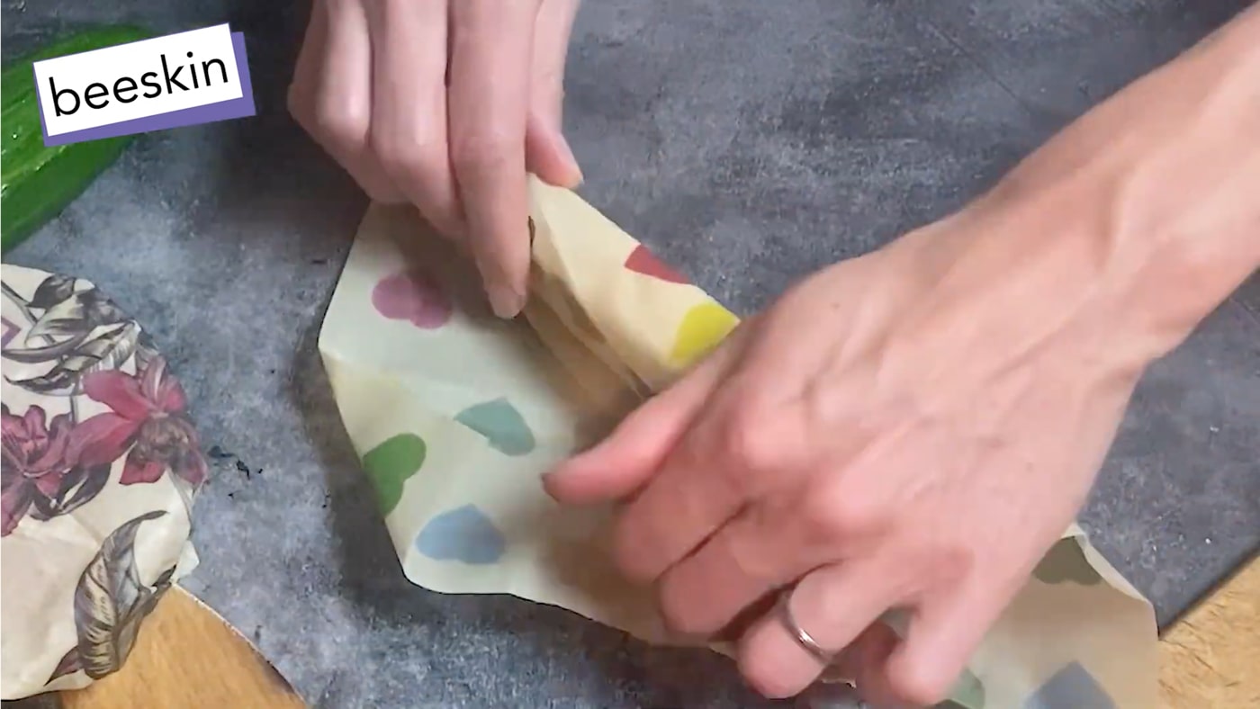 Load video: video shows how to wrap different food in beeskin beeswax wraps.