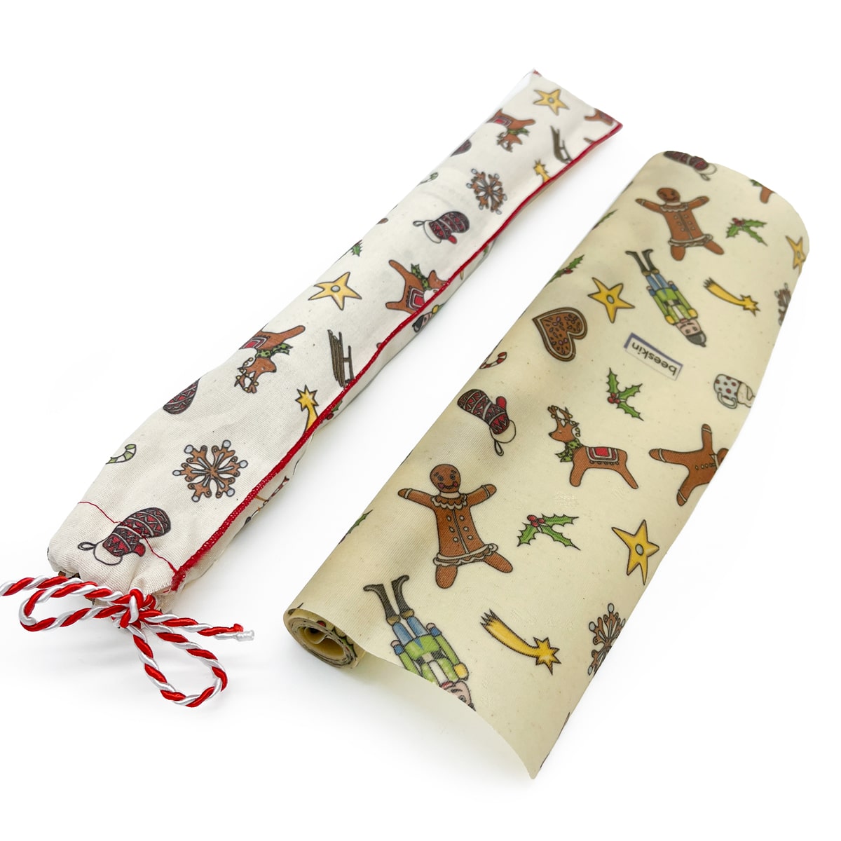 beeskin beeswax roll christmas design with suitable fabric package and a red/white ribbon to close