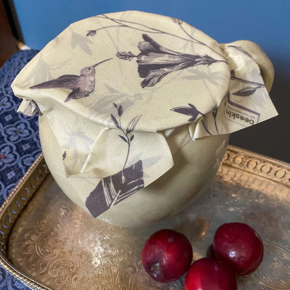 jug covered with beeskin beeswax wrap hummingbird on a tablet
