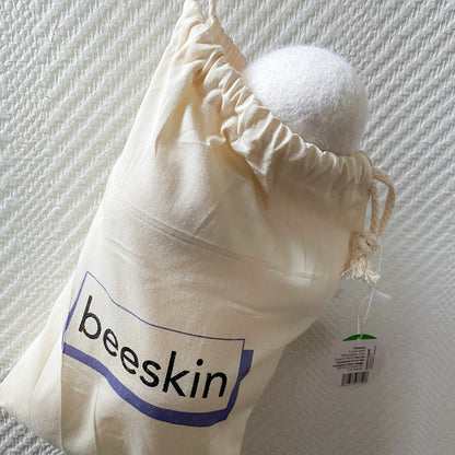 beeskin dryer balls in fabric bag with beeskin logo