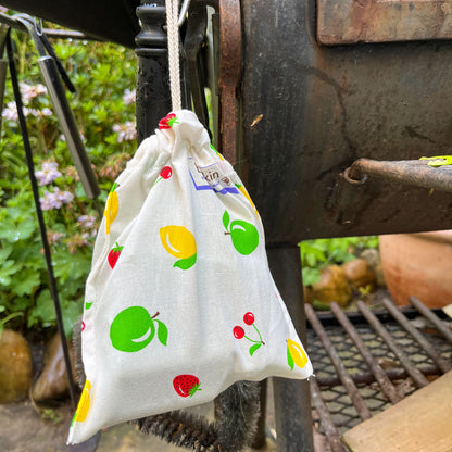 fabric bag with firestarters hanging at a bbq