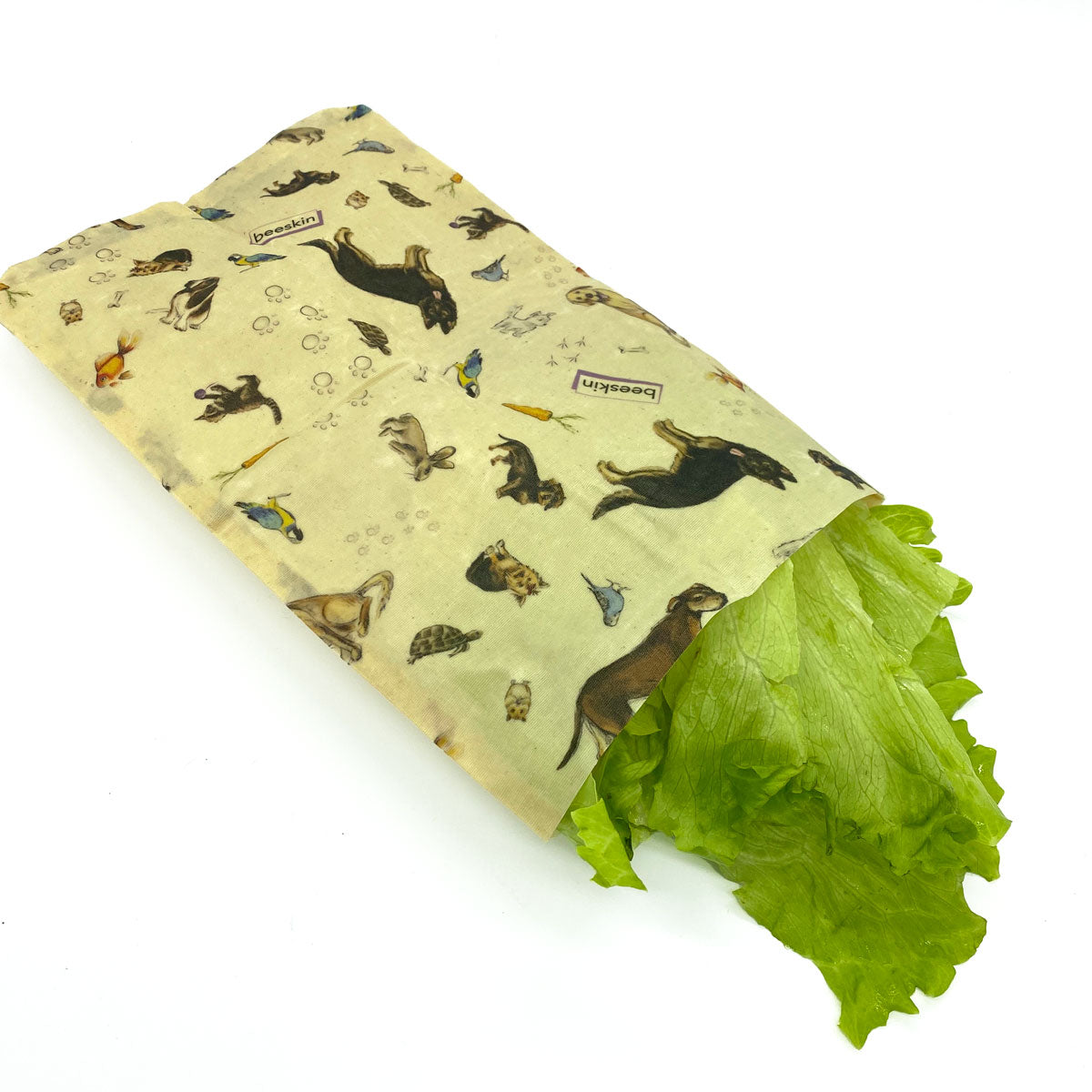 salad stored in a beeskin beeswax bag s with different animals on it