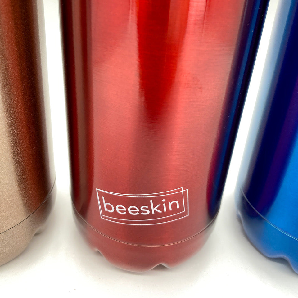 beeskin logo on red thermobottle