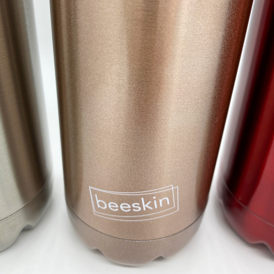 beeskin logo on rose gold thermobottle