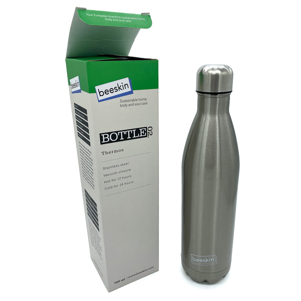 stainless steel thermobottle next to packaging