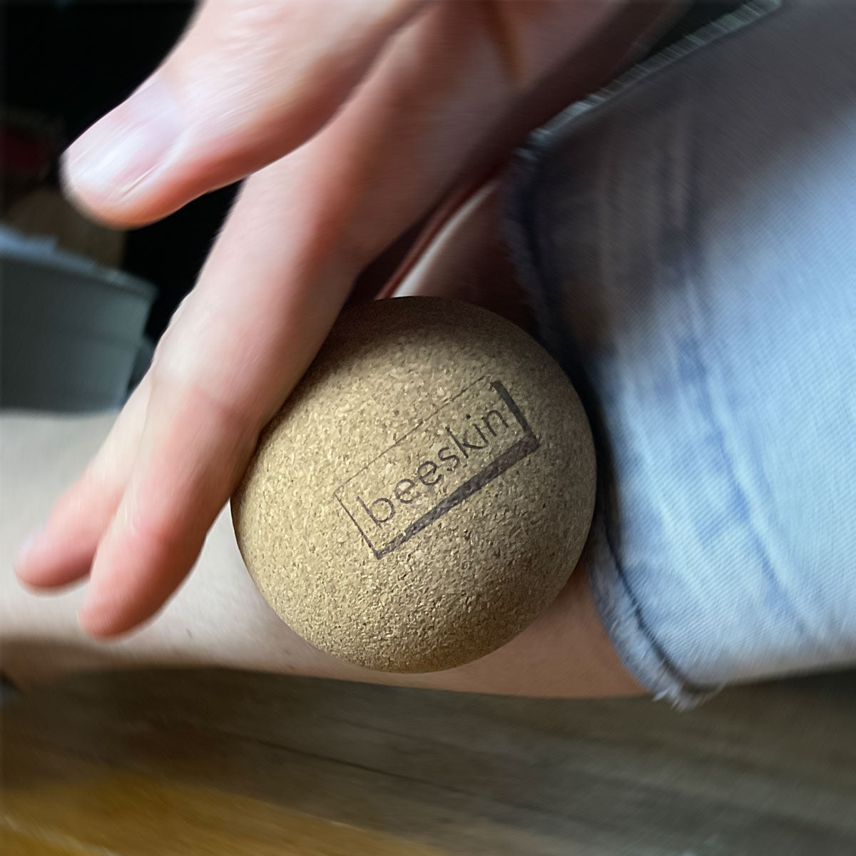 hand rolling on a leg with beeskin small fascia ball 