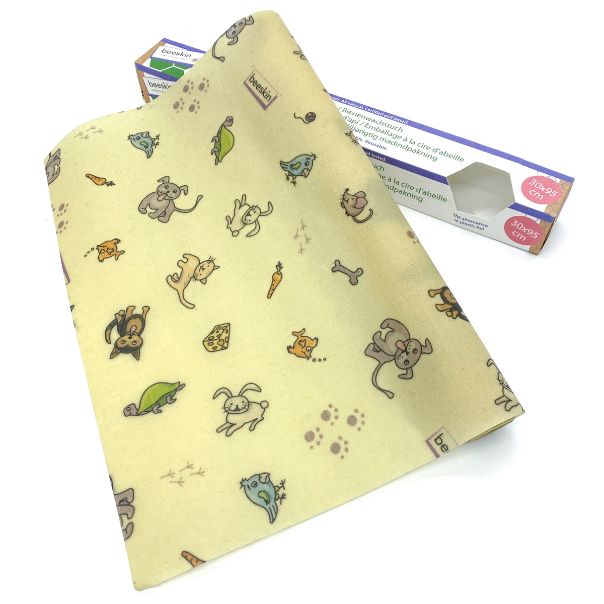 beeswax roll with pets printed on it next to package