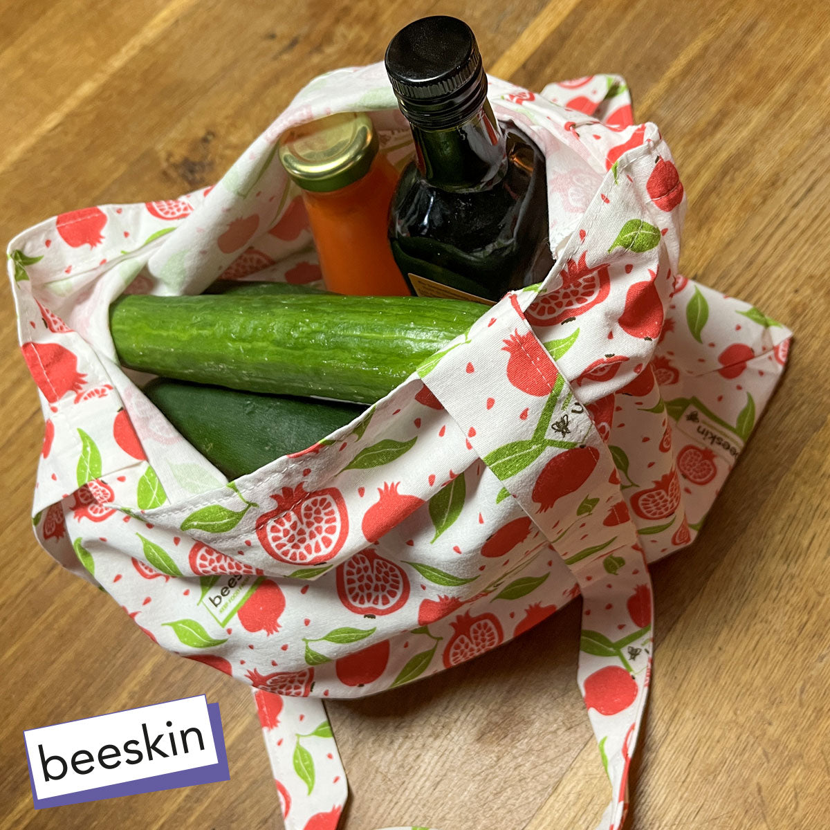 beeskin cotton-bag-pomegranate filled with cucumber and olive oil