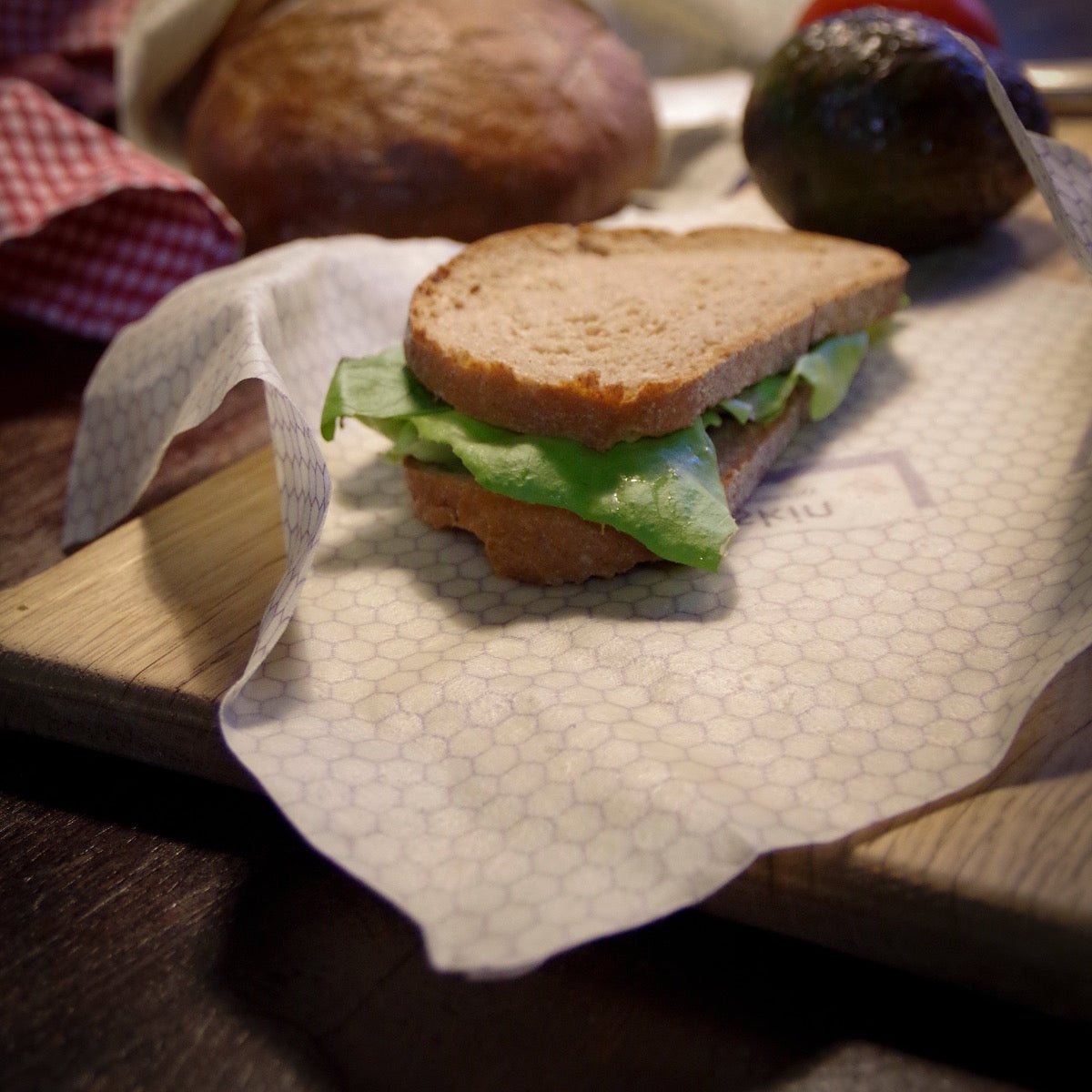 sandwich with salad lies on beeskin wrap honeycomb