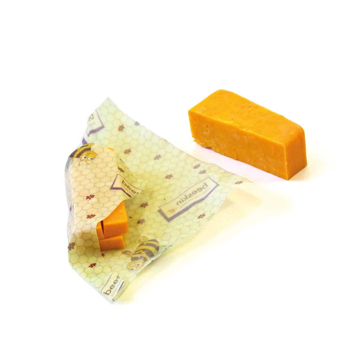 2 stings of orange cheese, red Leicester one of the two strings is wrapped in beeskin in kids design size s