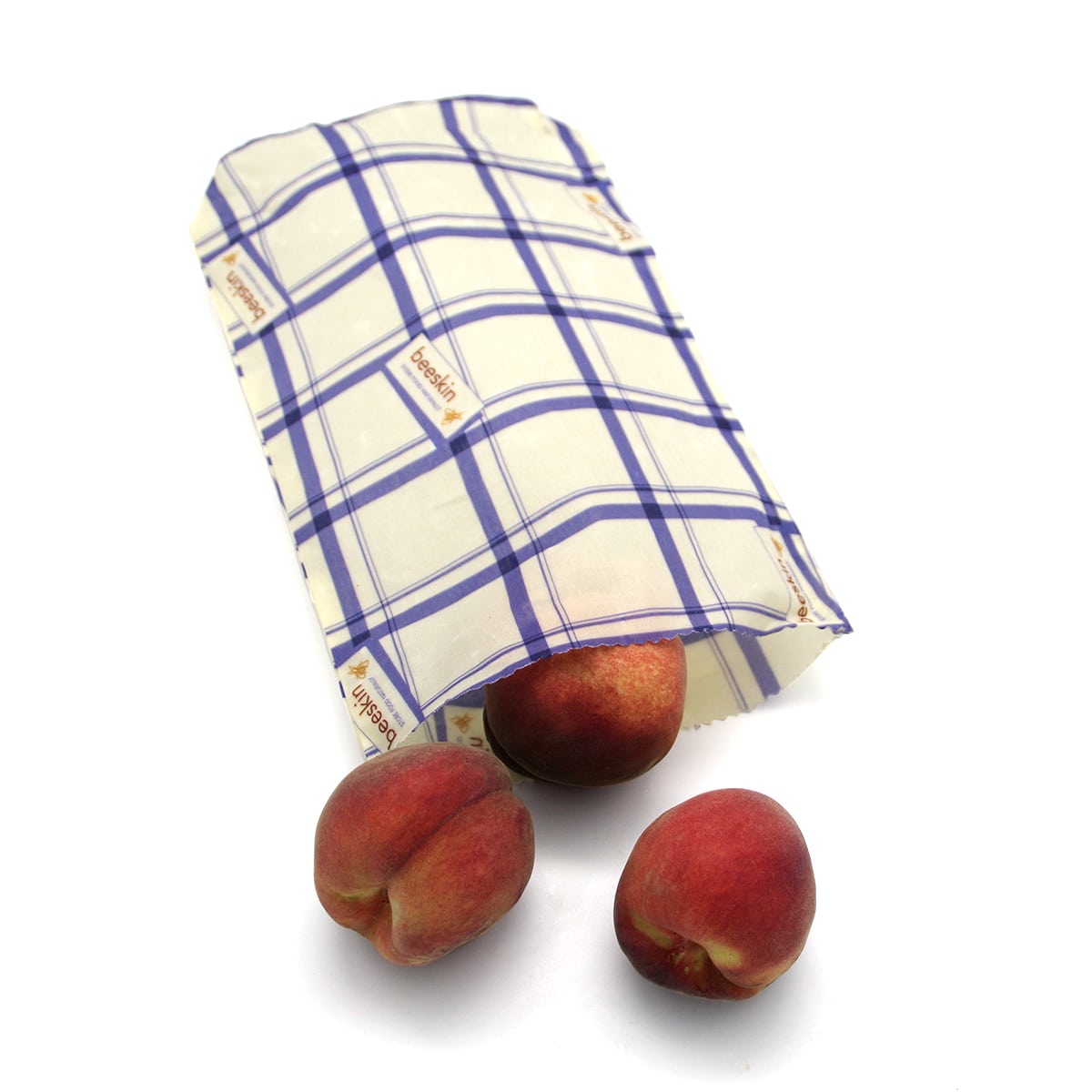 beeswax bag size s kitchen and peaches on a white background