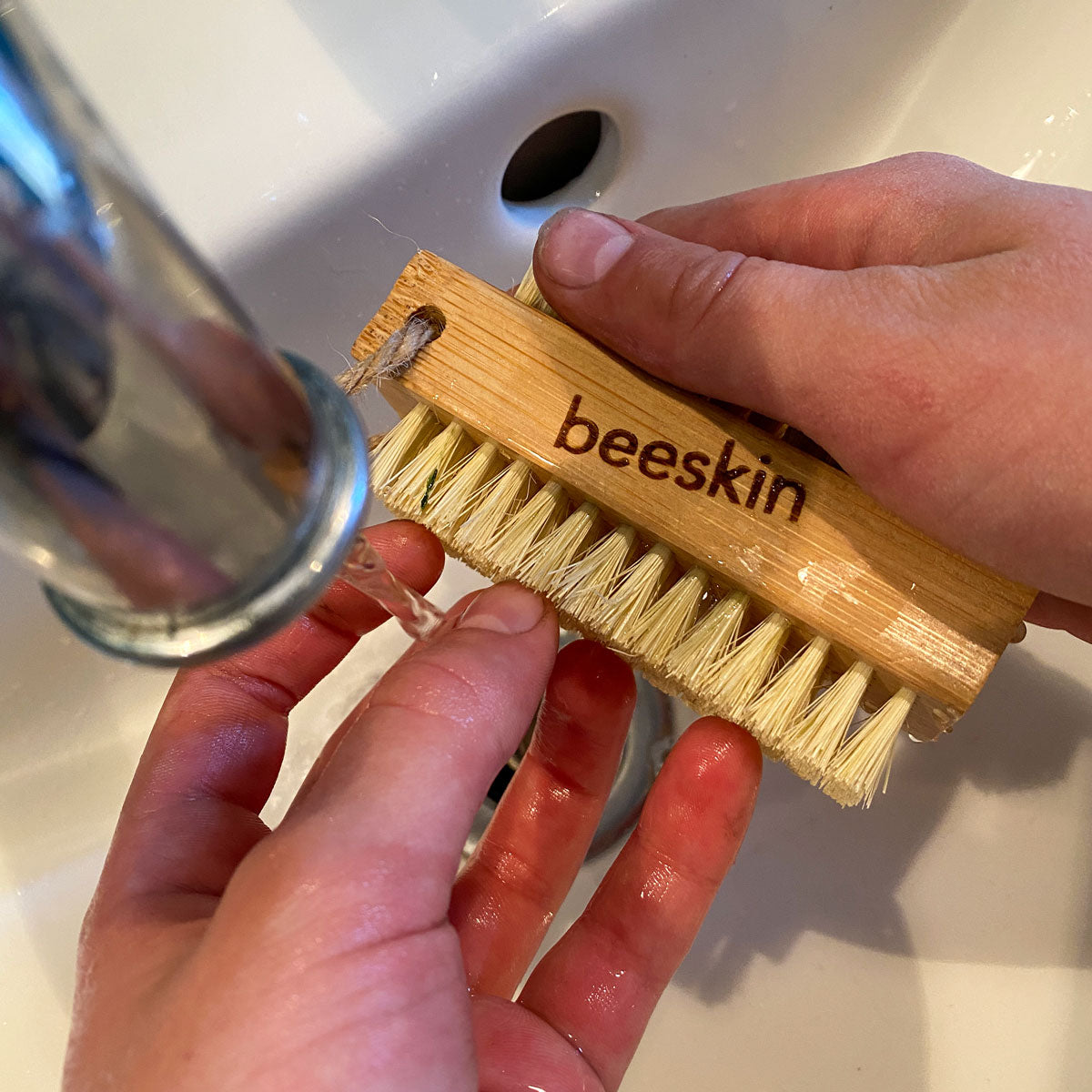 washing hands while using beeskin nailbrush