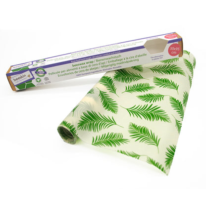 beeskin beeswax roll palm leaves next to packaging