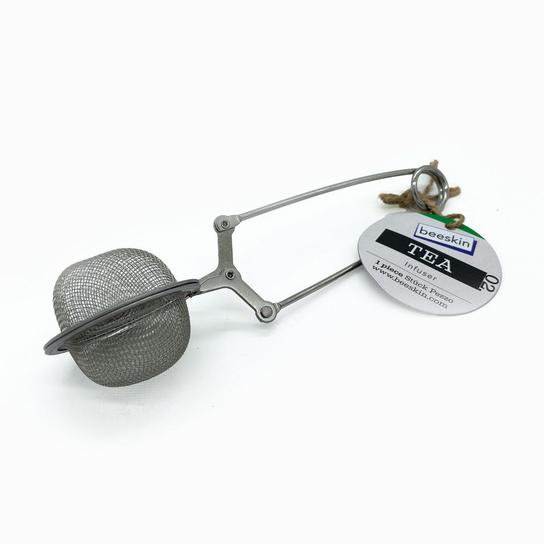 small tea infuser with a hanging tag on white